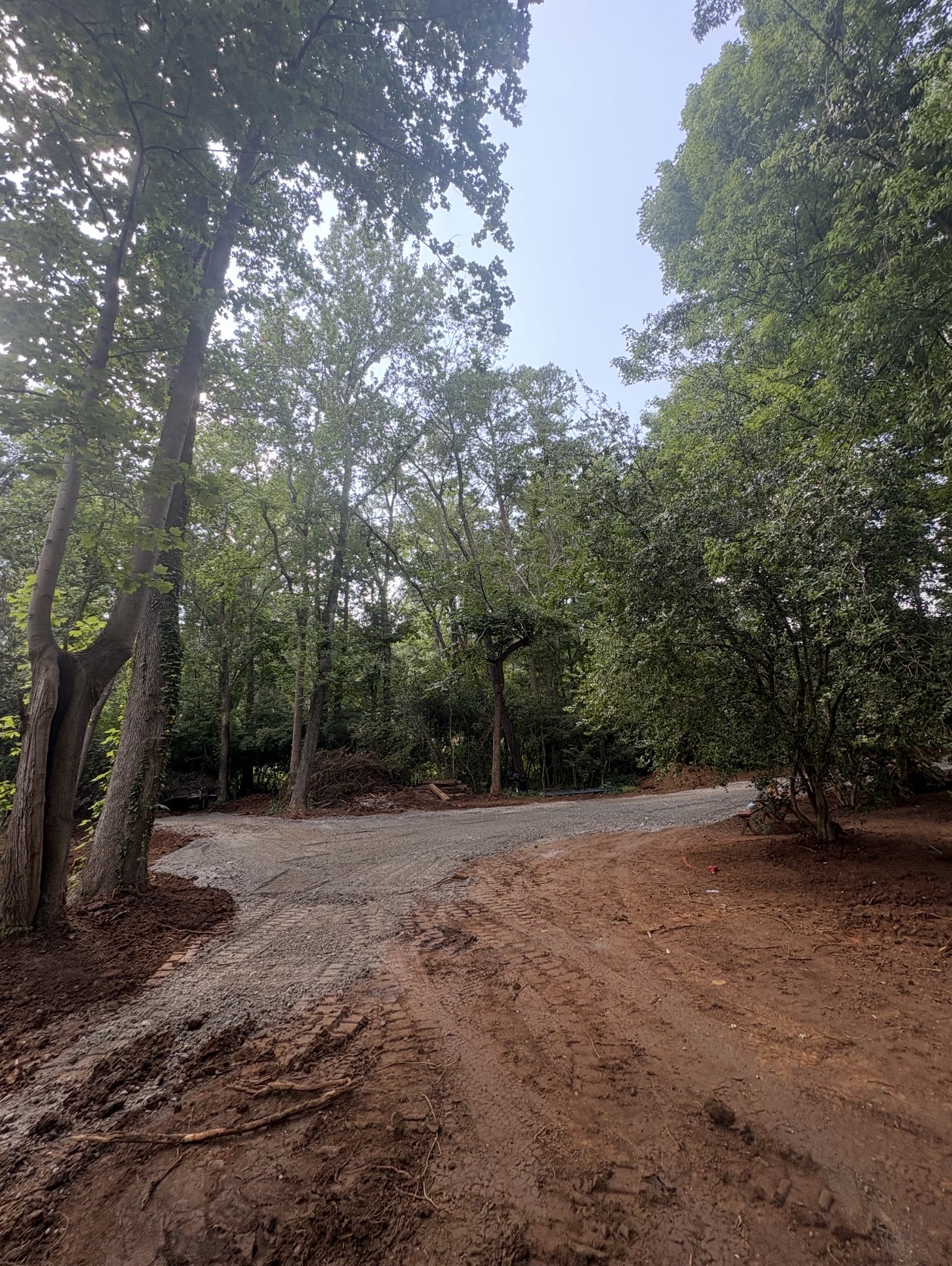 CLEARED AND LEVELED LOT WITH GRAVEL DRIVE