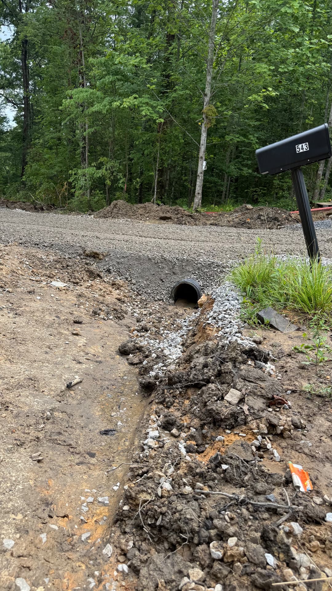 Culvert and drainage install at a driveway entrance